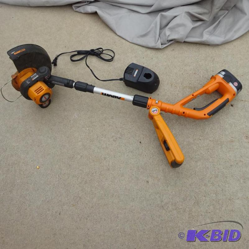 lot 168 image: Work battery powered weed whip. Works. But ne...