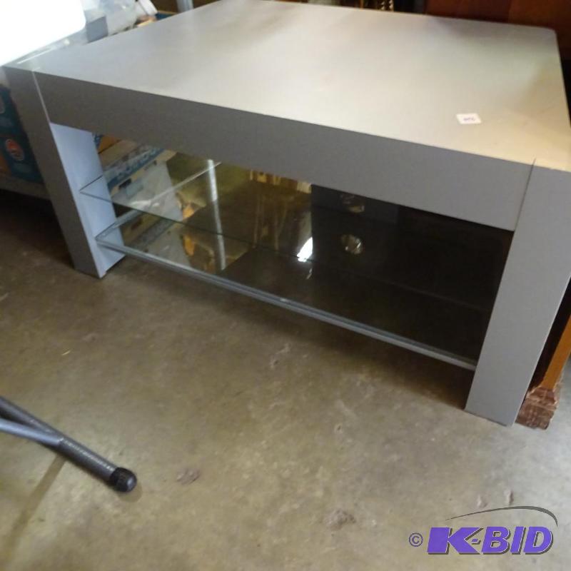 lot 198 image: laminate TV stand. 2 glass shelves. 40x22x19...