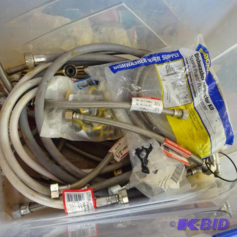 lot 203 image: Plastic tote with misc. sink connection hoses...