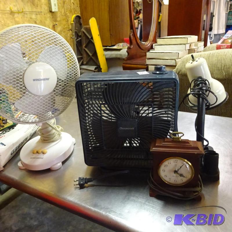 lot 213 image: 2 fans. Desk lamp. Vintage electric clock. Al...