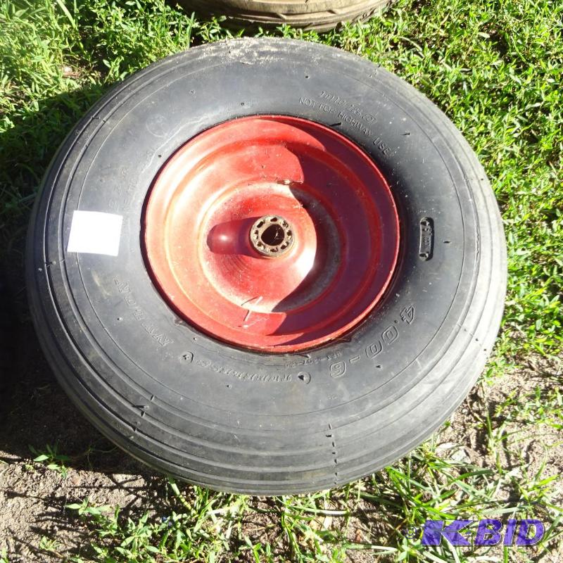 lot 24 image: 4.00-6 rim and tire...