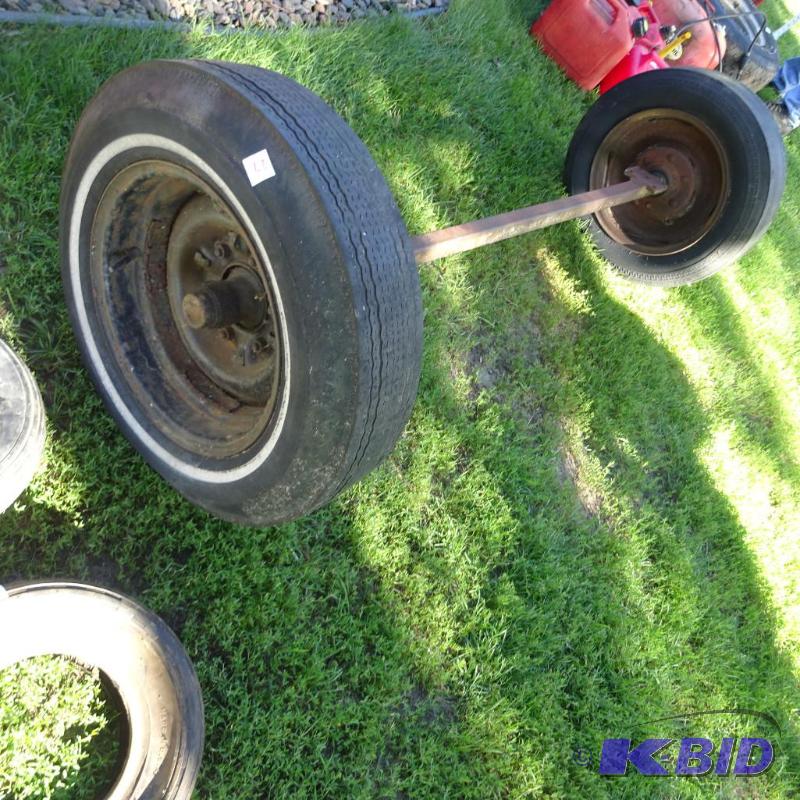 lot 27 image: trailer axle. 14" tires. 48" spring...