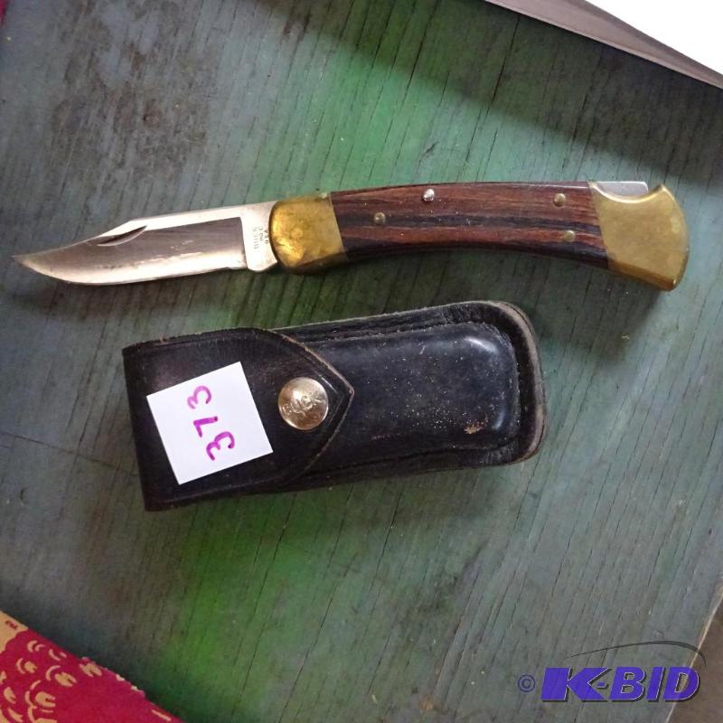 lot 373 image: buck folding knife...