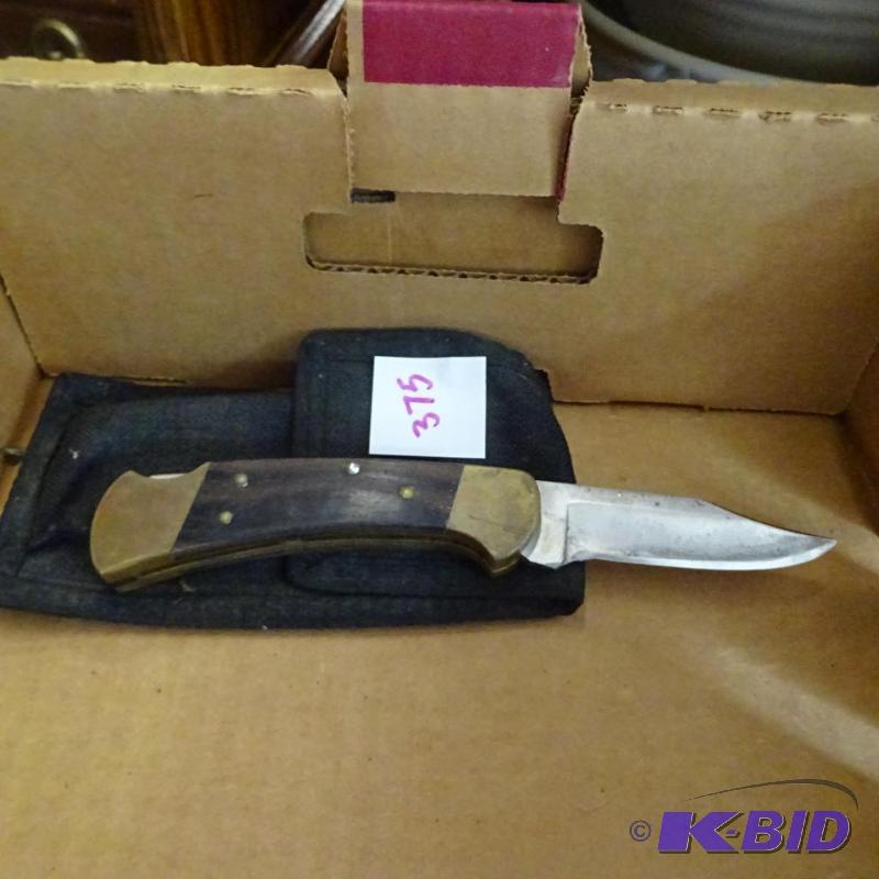 lot 375 image: buck folding knife...
