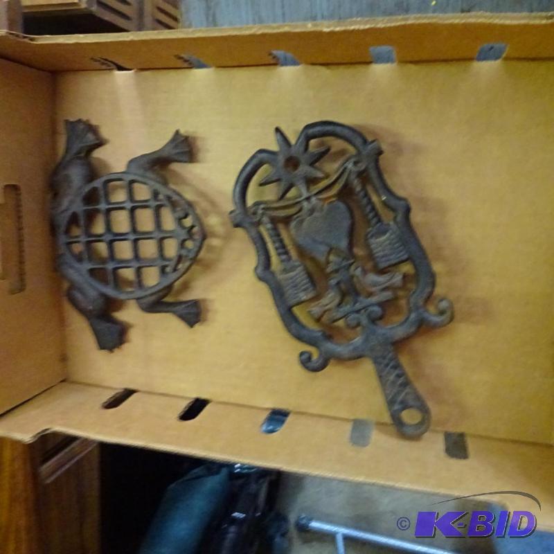 lot 376 image: cast iron hot pads...