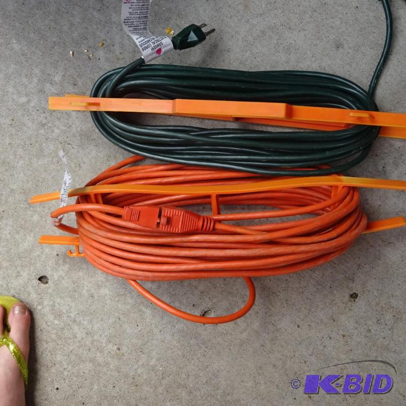 lot 438 image: 2 extension cords. 25 per cord...
