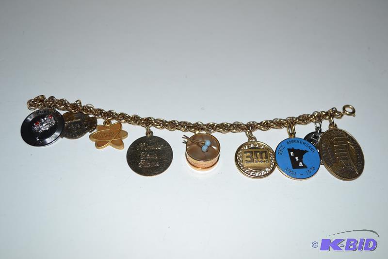lot 112 image: Charm bracelet might be 14k gold some charms ...