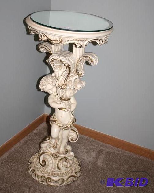lot 24 image: Angel or Cherub based table with mirrored rem...