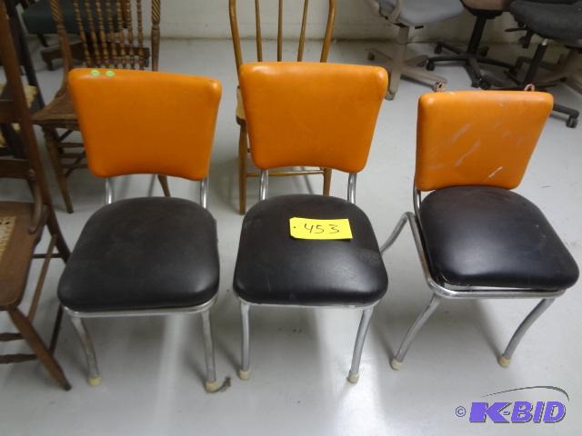 lot 453 image: Three Orange and Black ChromeVinyl Chairs...