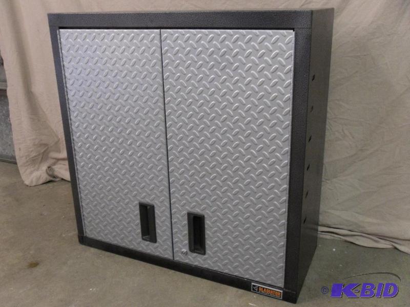 lot 13 image: Gladiator Hanging Wall Cabinet. 2 Adjustable ...