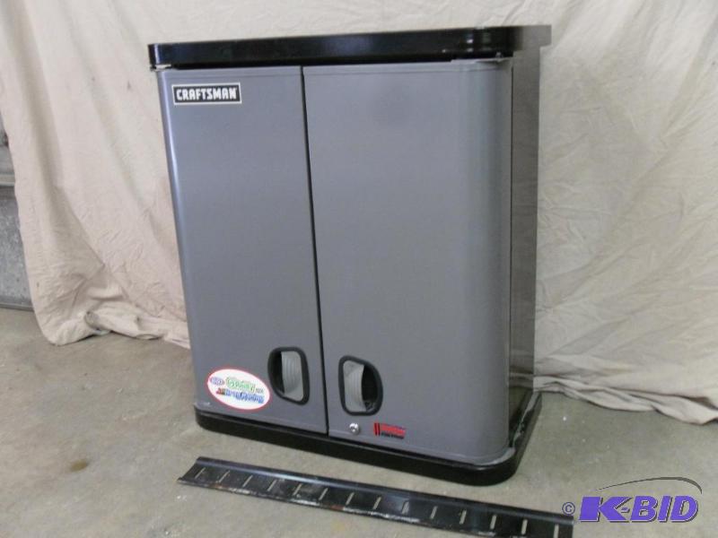 lot 15 image: Craftsman Hanging Wall Cabinet. Has 2 Adjusta...