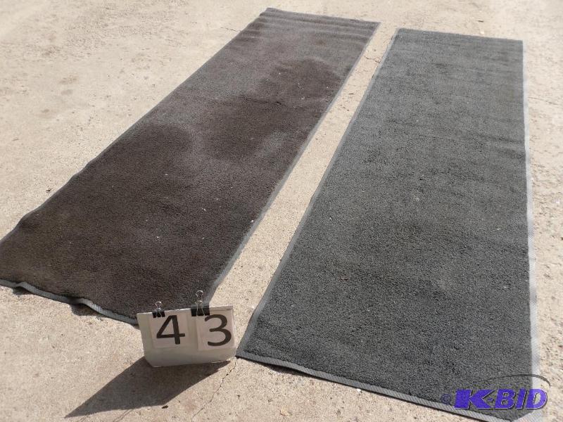 lot 43 image: 2 commercial entry rugs. Both have stains, on...