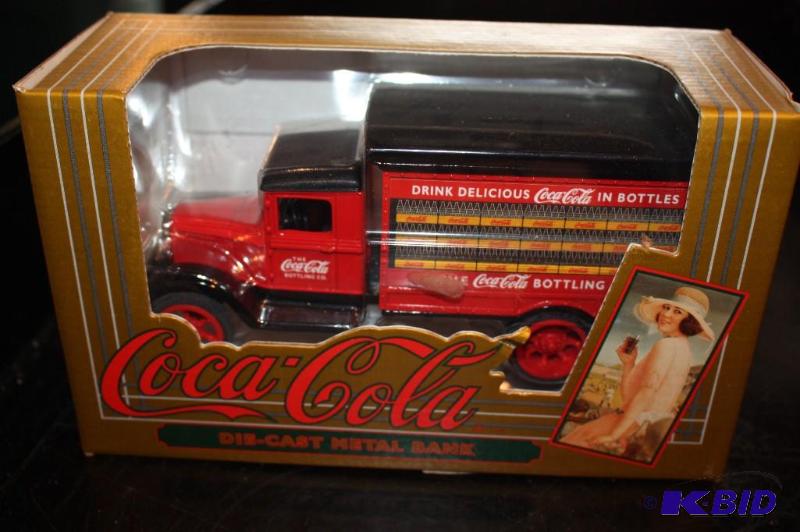 lot 109 image: CocaCola die-cast metal bank...