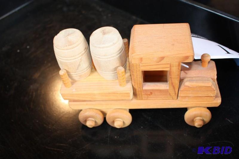 lot 13 image: A wooden toy truck with wooden barrels...