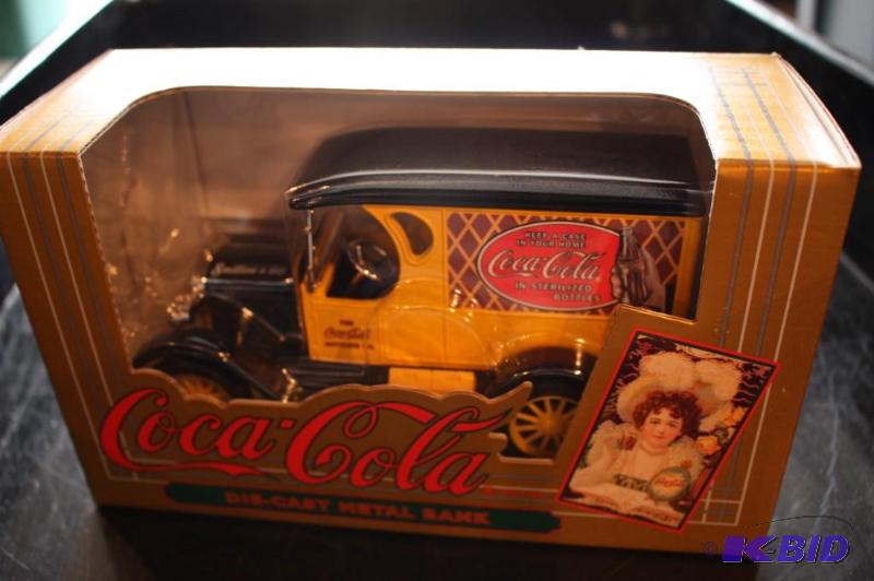 lot 135 image: CocaCola die-cast metal bank...