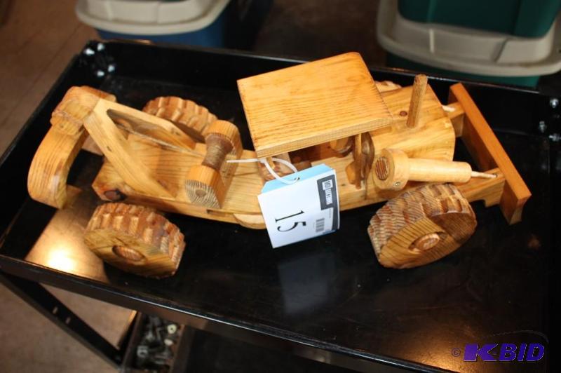 lot 15 image: A wooden toy tractor...