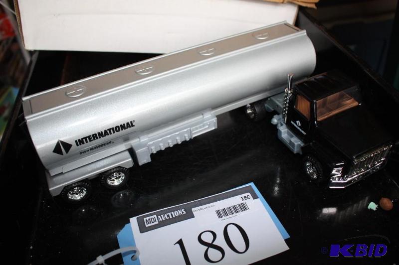 lot 180 image: International semi truck and trailer...