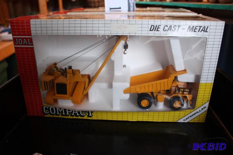 lot 193 image: Compact Caterpillar crane and dump truck...
