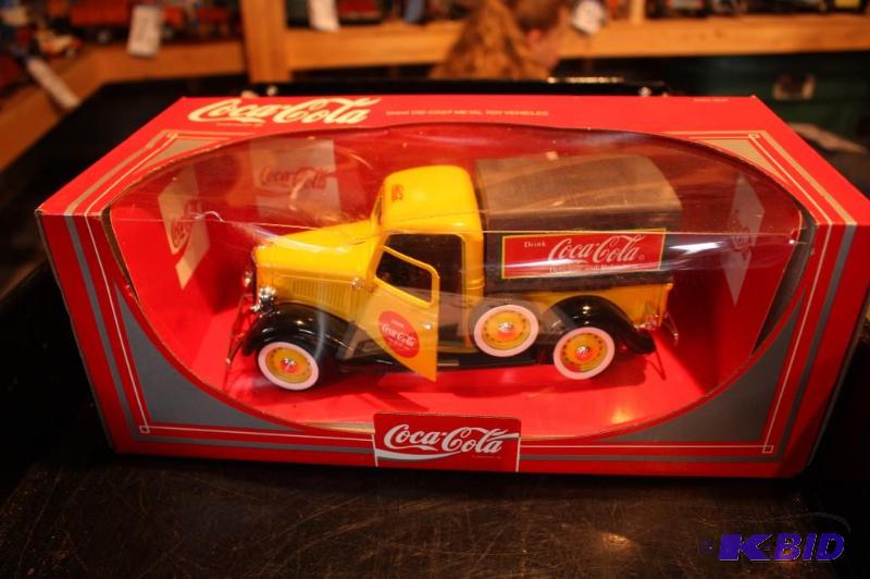 lot 235 image: CocaCola brand die-cast metal toy truck...