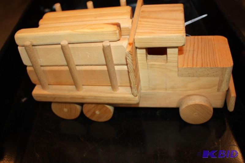 lot 27 image: A wooden toy lumber truck...