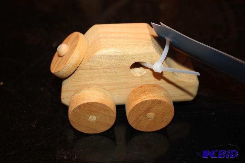 lot 29 image: A wooden toy car...