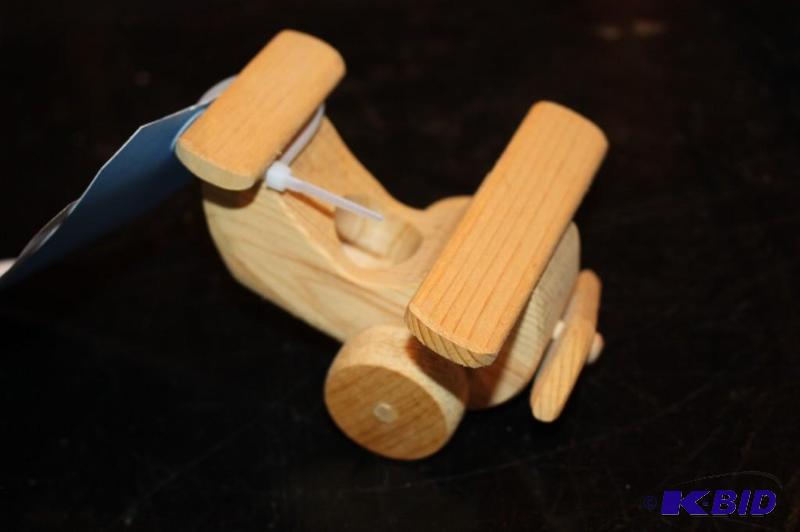 lot 30 image: A wooden toy plane...