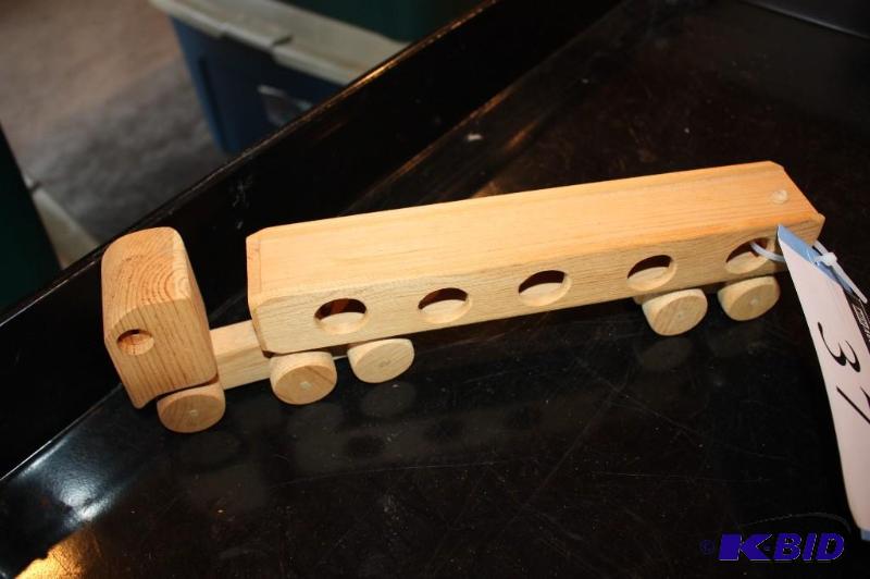 lot 37 image: A wooden toy semi truck...