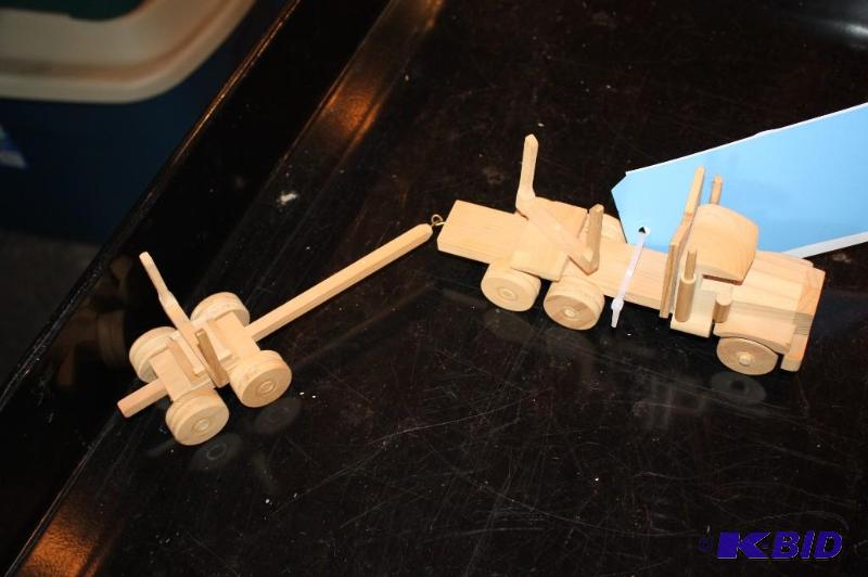 lot 41 image: A wooden toy truck with a trailer...