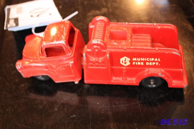 lot 50 image: A toy Municipal Fire Dept truck...