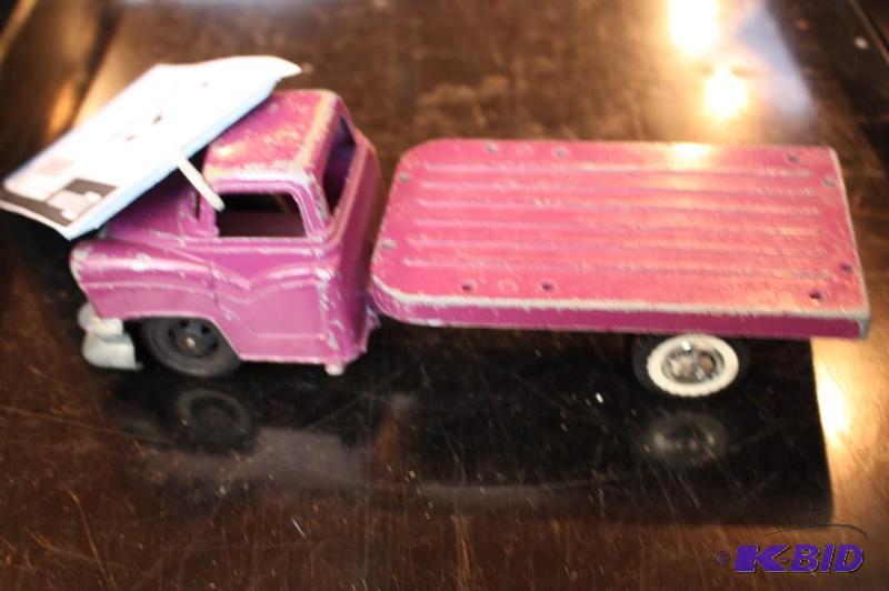 lot 51 image: A purple Hubley toy truck...