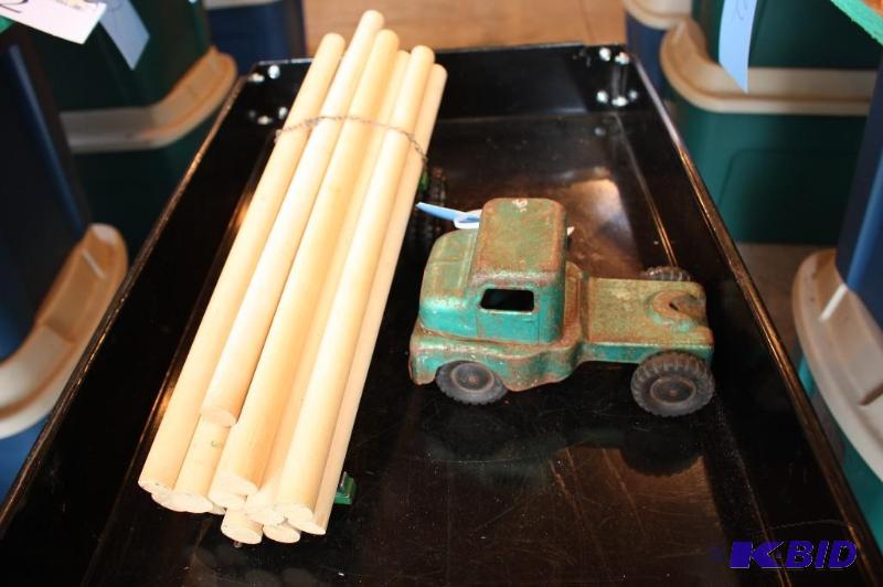 lot 56 image: A metal toy truck with a lumber trailer...