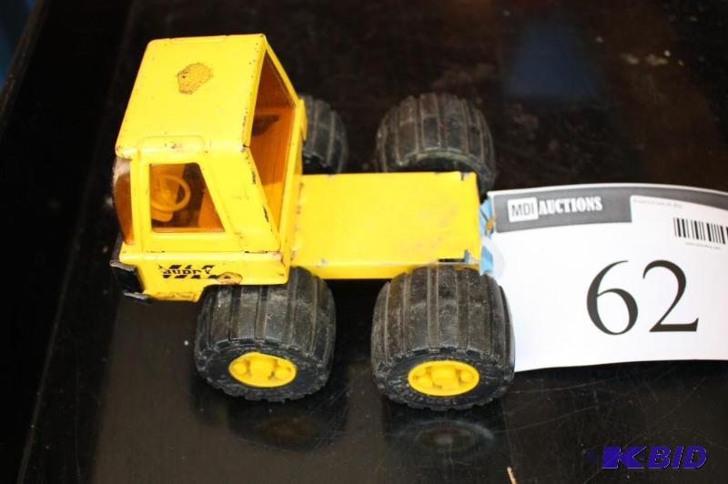 lot 62 image: A yellow toy truck...