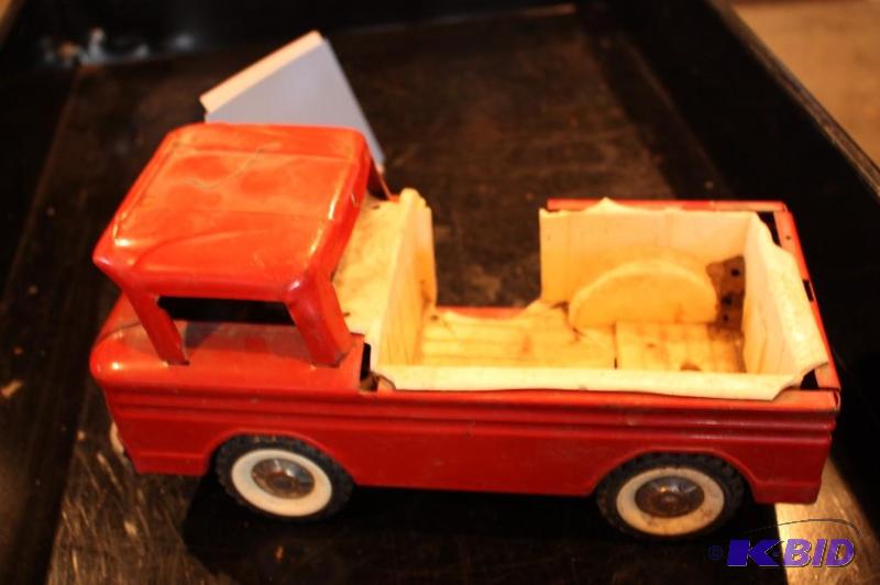 lot 96 image: A red vintage toy truck...