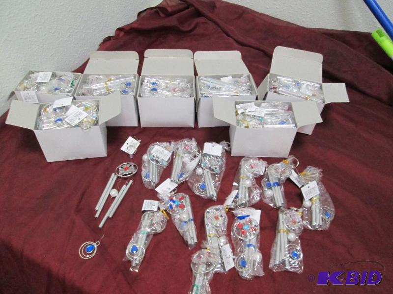 Qty 8 boxes of wind chimes, assortment of col...