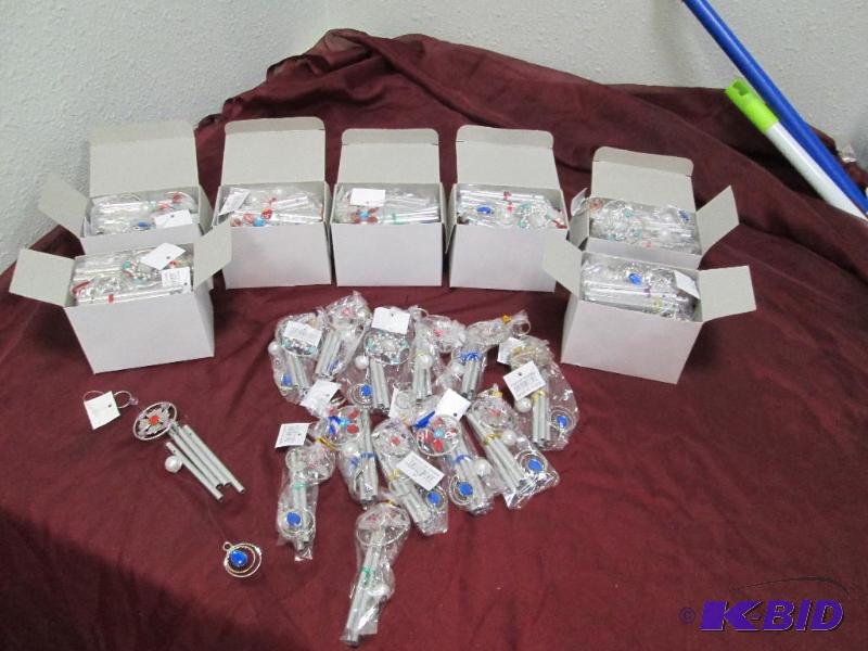 Qty 8 boxes of wind chimes, assortment of col...