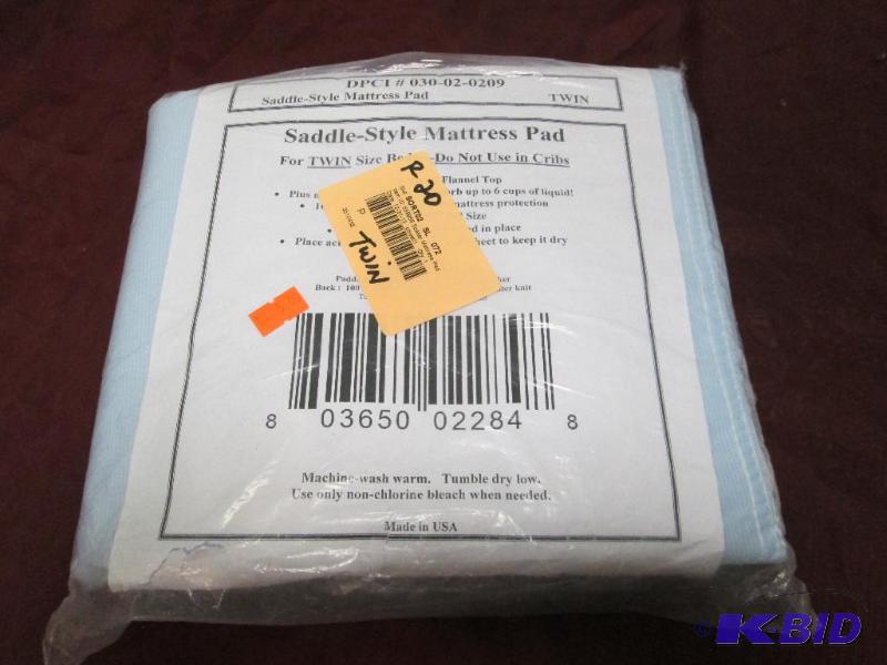 Saddle-style mattress pad fits twin bed size ...