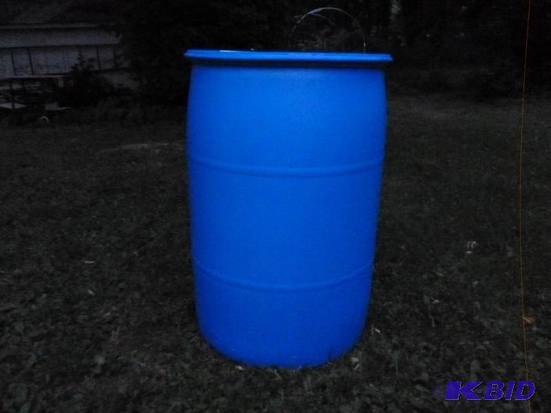 lot 18 image: Large 55 gallon plastic drum, comes with two ...
