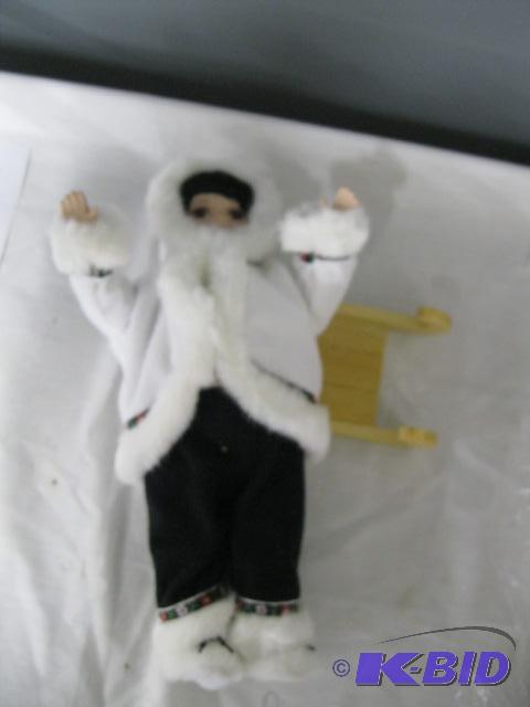 Eskimo Porcelain Doll on sled