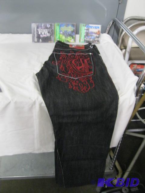 lot 48 image: Coogi Jeans Size 38 brand new, Playstation driver, Syphon Filter, Resident Evil