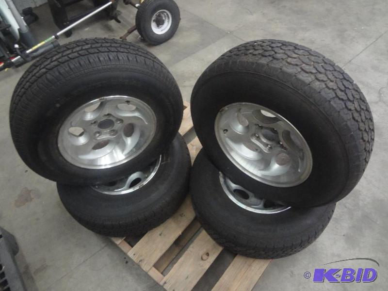 lot 45 image: (2) 5-Lug Aluminum Rims With P2357515 Tires...