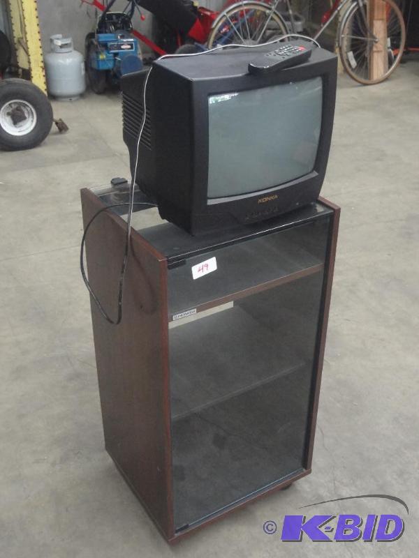 lot 49 image: Glass Front Rolling Stereo Cabinet With Konik...