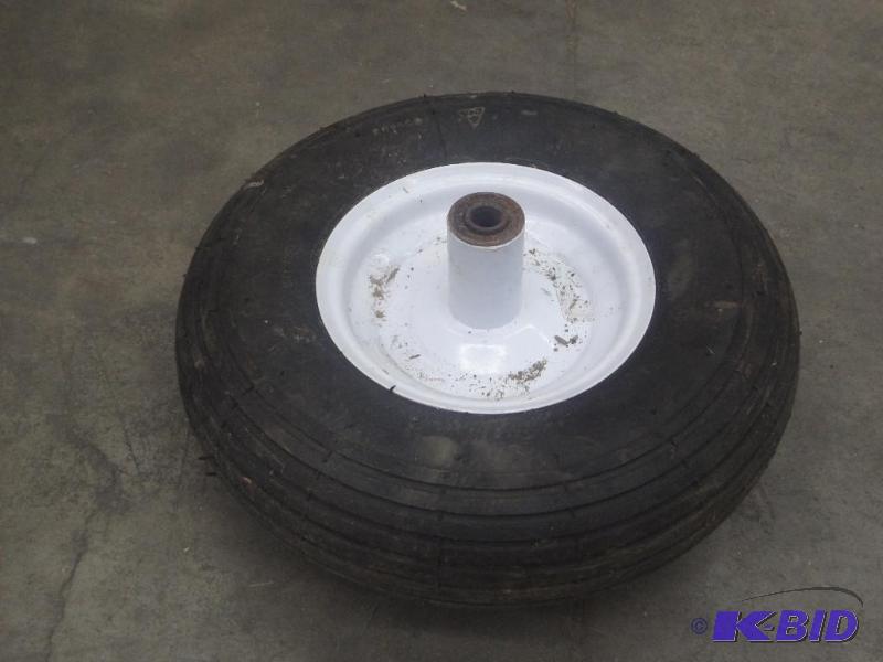 lot 78 image: Like New Wheel Barrel Tire & Rim...