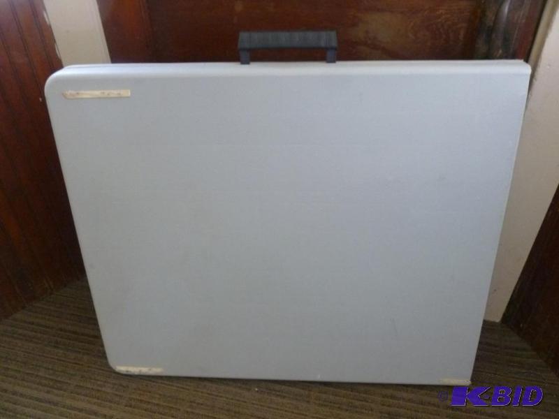 lot 16 image: Heavy gage plastic fold up table that measure...