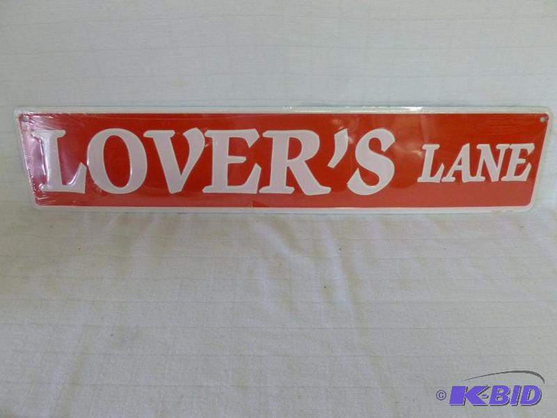 lot 98 image: Lovers Lane embossed metal sign that measure...