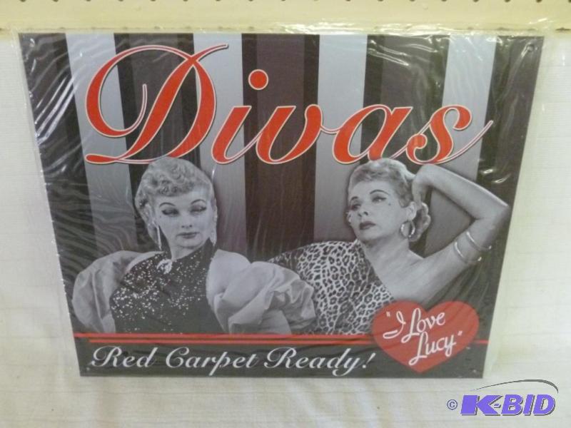 lot 99 image: I Love Lucy metal sign that measures 12"...