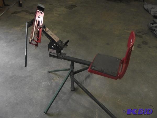 lot 110 image: Clay Pigeon Thrower   Seat back is broken but...