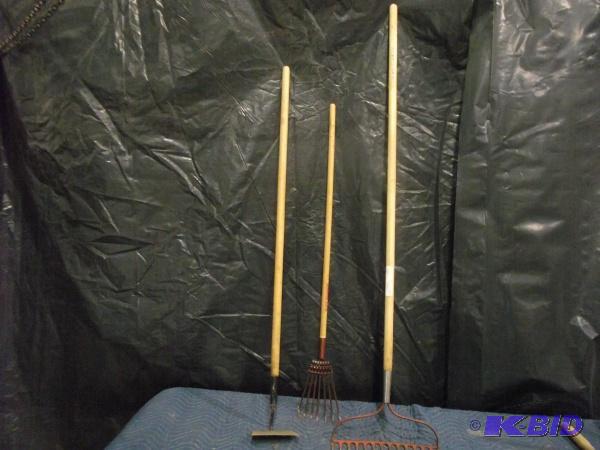 lot 24 image: Yard Tools   (1) Rake  (1) Small rake  (1) Ho...