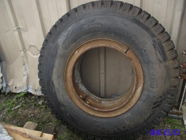 lot 34 image: Large Tire With Split Rim   12.00-20 Tire  Ap...