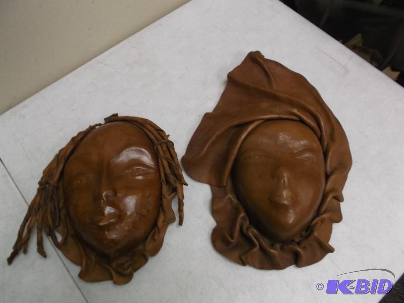lot 48 image: Pair Of Leather Faces - Wall Decor...