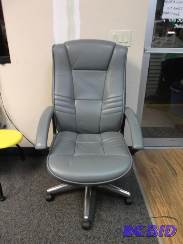 lot 8 image: Gray Office Chair, Has Some Wear Marks On Bac...